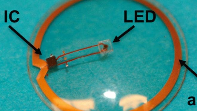 The LED, antenna, and integrated circuit embedded in a plastic contact lens.   