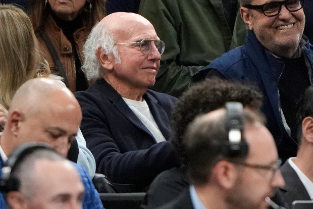 Actor Larry David watches from the stands as UConn and Illinois warms up prior to the first half of the Elite 8 college basketball game in the men's NCAA Tournament, Saturday in Boston. (AP Photo/Michael Dwyer)