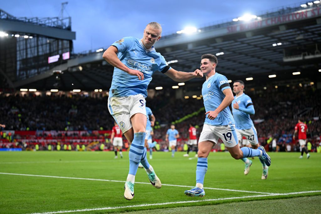 Erling Haaland celebrates scoring a goal for Manchester City against Manchester United in the Manchester derby