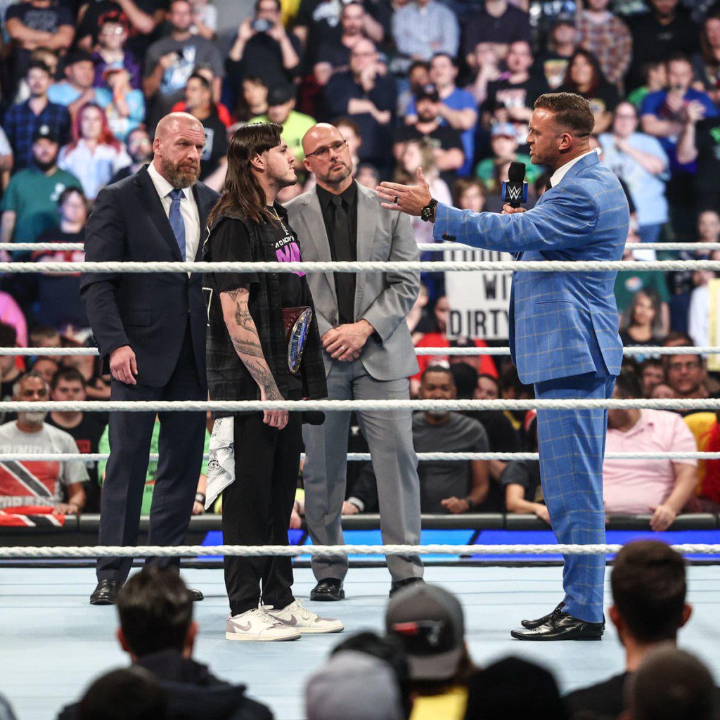 WWE boss Triple H, AKA Paul Levesque, with Raw General Manager Adam Pearce, SmackDown chief Nick Aldis, and superstar Dominik Mysterio