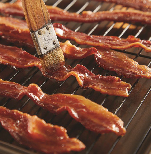 Maple Syrup-Glazed Bacon is a sweet-salt-fat combination that takes beloved bacon to greater heights. It makes a fun garnish for a Bloody Mary. (Photo by Kevin Scott Ramos)