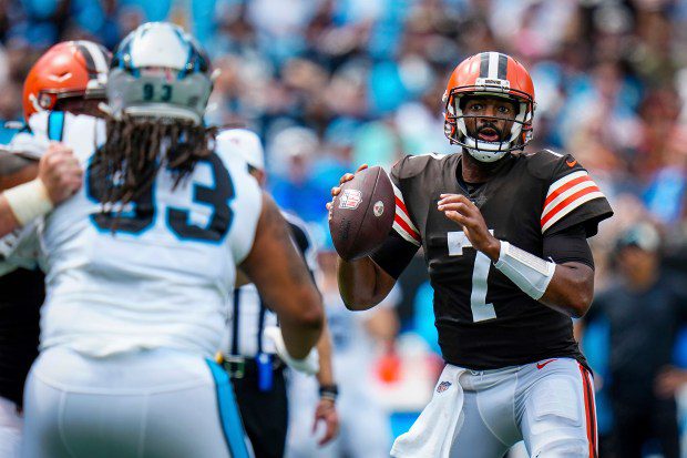 Cleveland Browns quarterback Jacoby Brissett (7) looks to pass under pressure form Carolina Panthers defensive tackle Bravvion Roy (93) during an NFL game on Sunday, Sept. 11, 2022 in Charlotte, N.C. (AP Photo/Rusty Jones)
