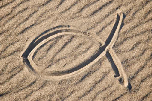 Christian Jesus Fish Symbol in the Sand