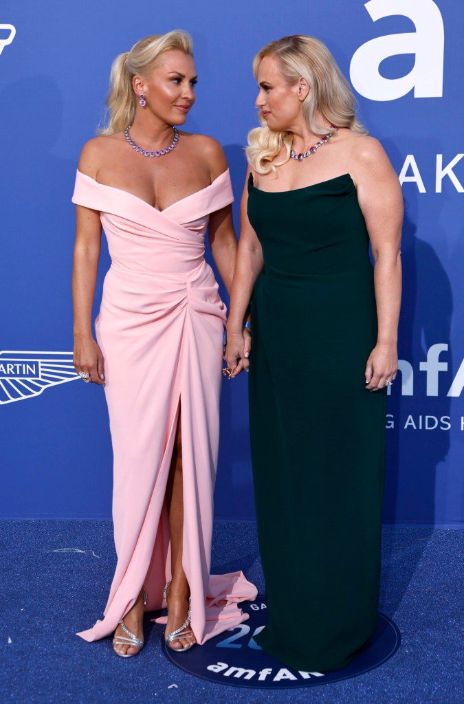 Ramona Agruma, left, and Rebel Wilson pose for photographers upon arrival at the amfAR Cinema Against AIDS benefit at the Hotel du Cap-Eden-Roc, during the 76th Cannes international film festival, Cap d'Antibes, southern France, Thursday, May 25, 2023