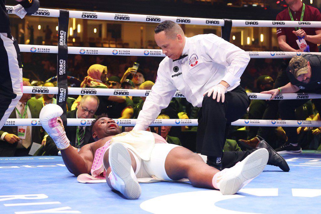 Francis Ngannou reacts to defeat after being knocked down for the third time by Anthony Joshua
