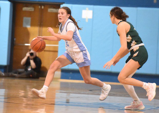 North Penn's Cameron Crowley, 2, drives up the court as Emmaus' Gabby DeVita, 4, defends during their PIAA-6A first round game on Friday, March 8, 2024. (Mike Cabrey/MediaNews Group)