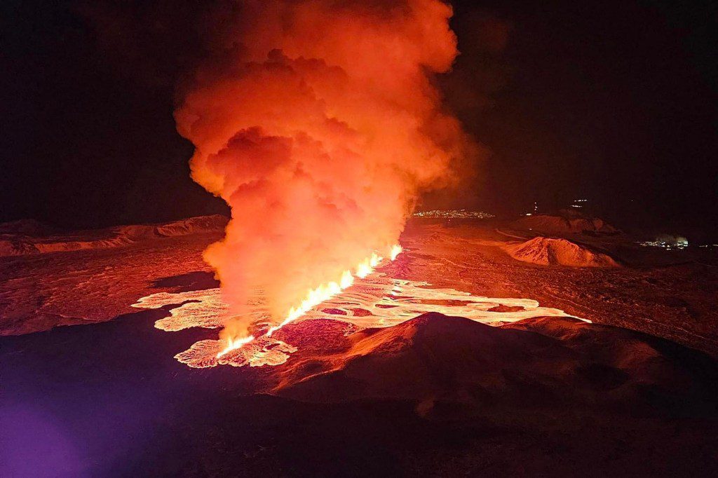 Billowing smoke and flowing lava are seen pouring out of a new fissure in this Icelandic Department of Civil Protection and Emergency Management , February 8, 2024, handout image during a new volcanic eruption on the outskirts of the evacuated town of Grindavik, western Iceland. A volcanic eruption started on the Reykjanes peninsula in southwestern Iceland on Thursday, the third to hit the area since December, authorities said. (Photo by Icelandic Department of Civil Protection and Emergency Management / AFP) (Photo by ICELANDIC DEPARTMENT OF CIVIL PROTECTION AND EMERGENCY MANAGEMENT/AFP via Getty Images)