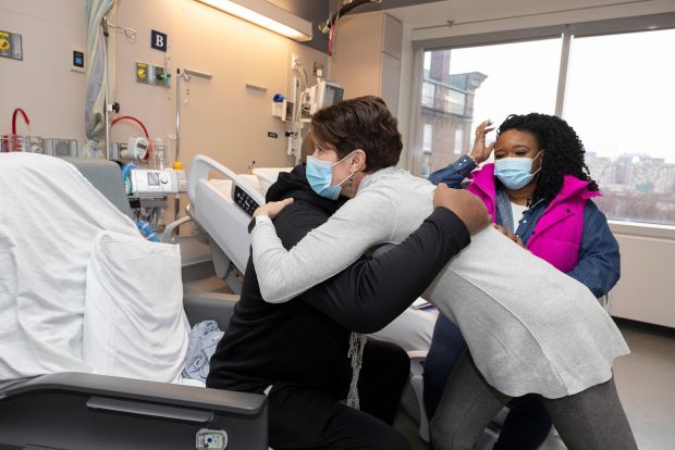 Rick Slayman hugs his patient advocate, Susan Klein, before being discharged. (Michelle Rose/Massachusetts General Hospital)