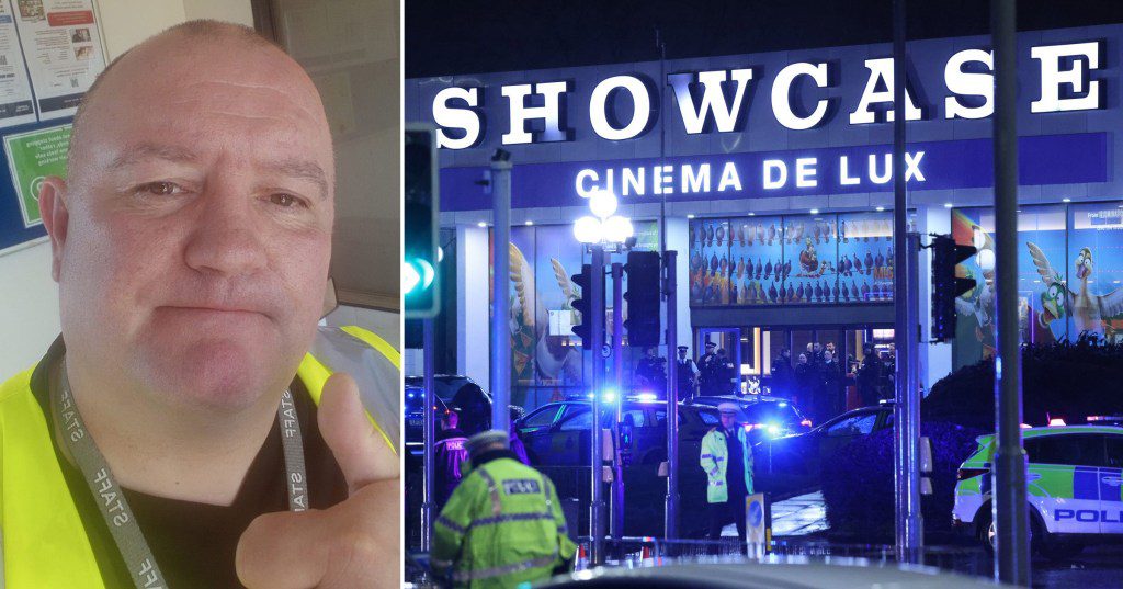 Leslie Garrett smirking with a thumb up as he wears a yellow hi-vis vest. To the right is an image of the Showcase Cinema lit blue by police lights.