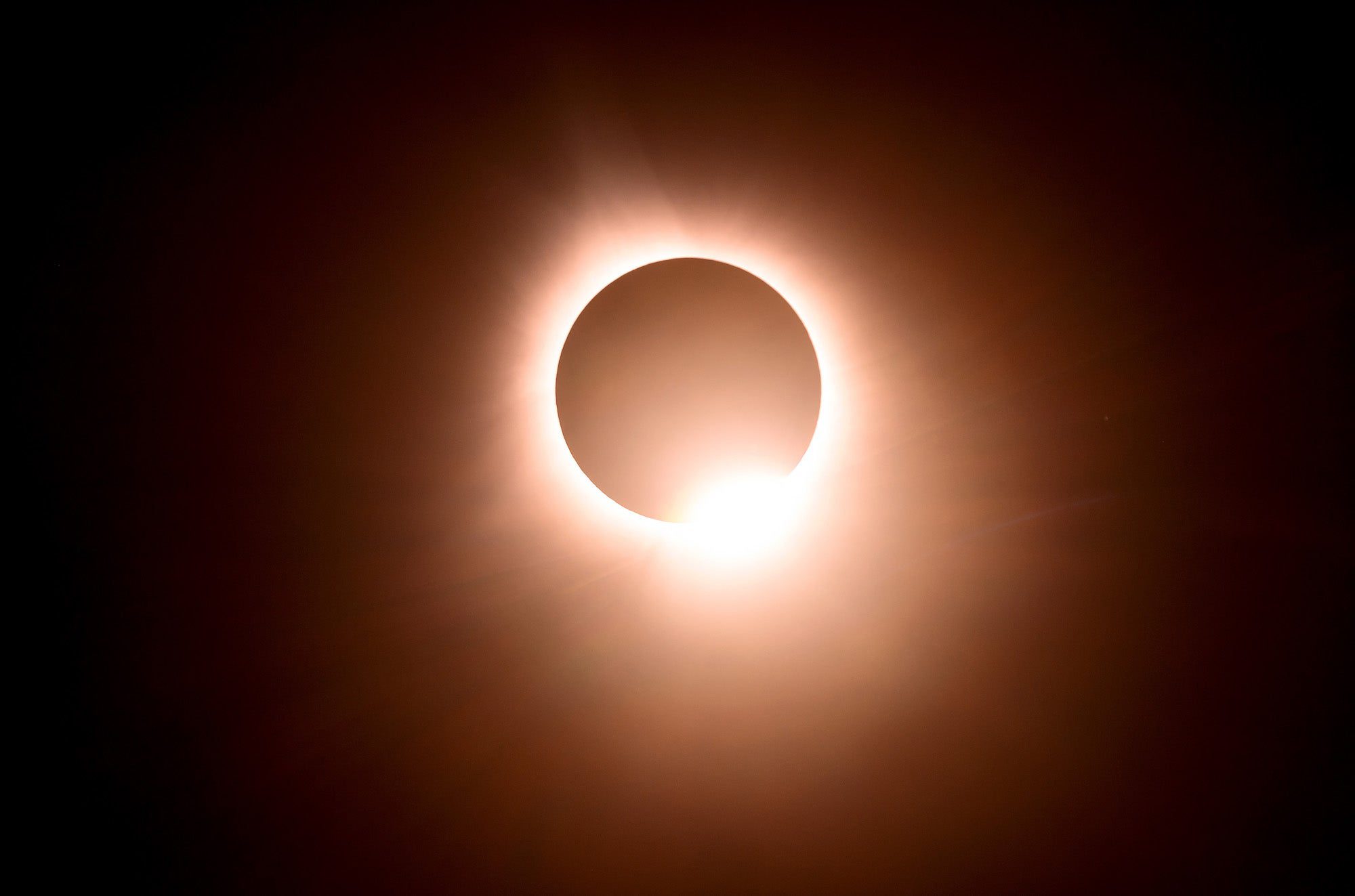 The moon eclipses the sun during a total solar eclipse across North America, in Bloomington, Indiana, on April 8, 2024. This year's path of totality is 115 miles (185 kilometers) wide and home to nearly 32 million Americans, with an additional 150 million living less than 200 miles from the strip. The next total solar eclipse that can be seen from a large part of North America won't come around until 2044. (Photo by JOSH EDELSON / AFP)