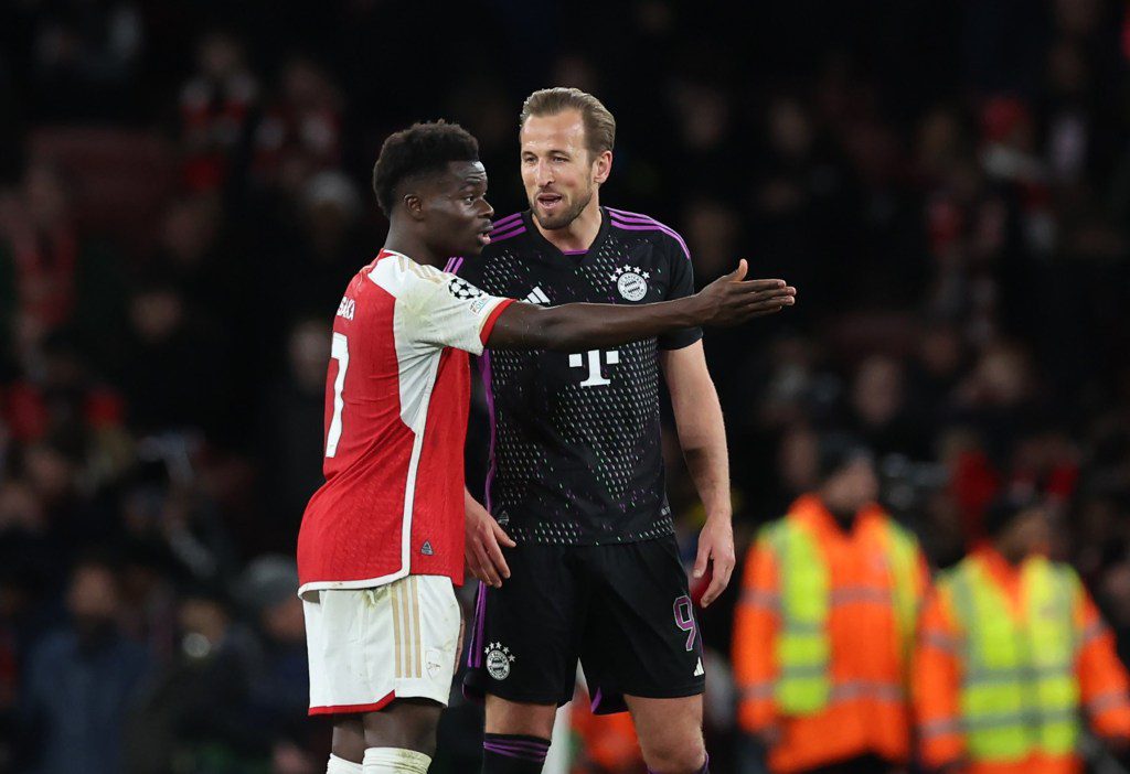 Harry Kane of Bayern Munich speaks with Bukayo Saka of Arsenal at the end of the UEFA Champions League quarter-final first leg match between Arsenal FC and FC Bayern Munich