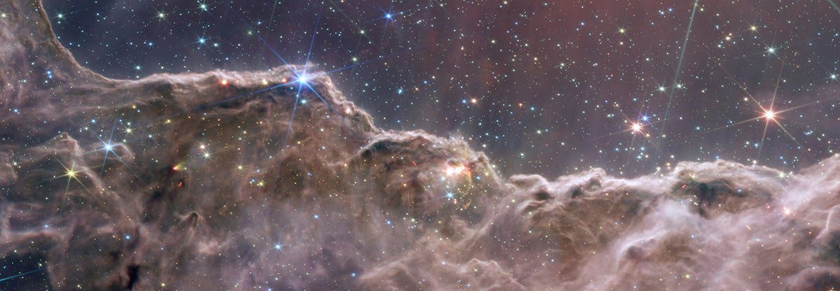 dusty space clouds with shining stars at the clouds peaks 