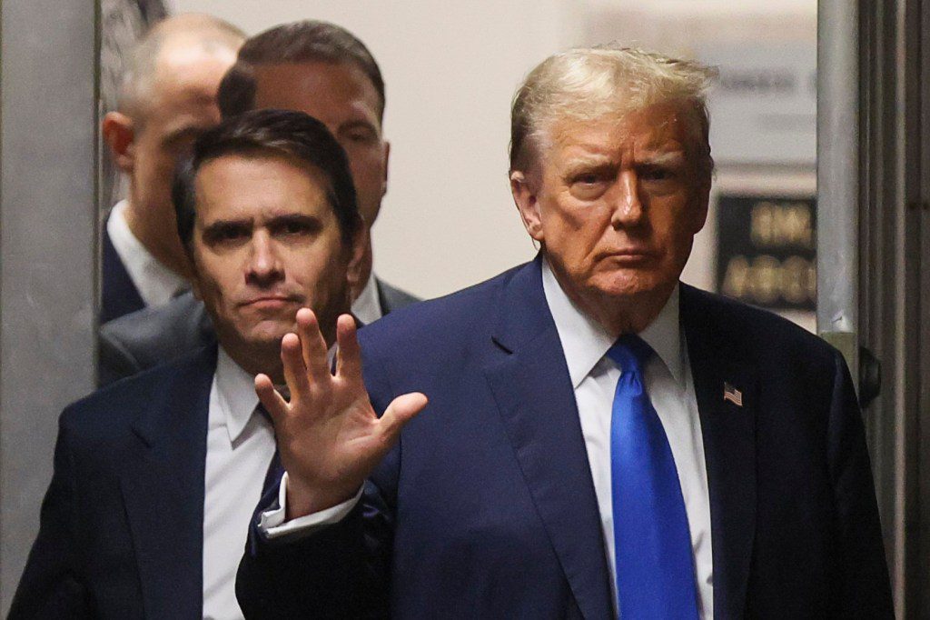 epa11286747 US former president Donald Trump gestures, next to his attorney Todd Blanche, as he returns to the courtroom following a break at Manhattan criminal court as jury selection continues in New York, New York, USA, 18 April 2024. Trump's criminal trial resumes with Judge Juan Merchan seeking to complete jury selection. Trump is facing 34 felony counts of falsifying business records related to payments made to adult film star Stormy Daniels during his 2016 presidential campaign. EPA/BRENDAN MCDERMID / POOL