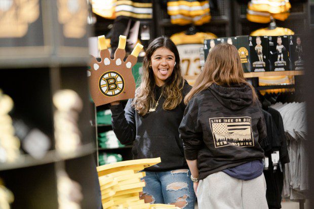 Bedford New Hampshire's Nevey Palacios poses with a Bruins foam finger at Boston Pro Shop. (Libby O'Neill/Boston Herald)