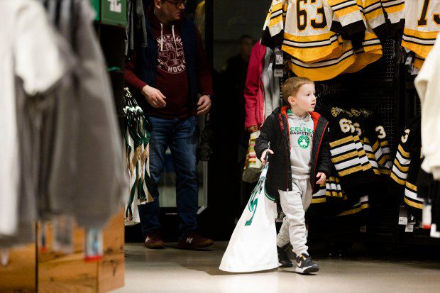 Brimfield's Finnegan Parent browses through the apparel at Boston Pro Shop. (Libby O'Neill/Boston Herlad)