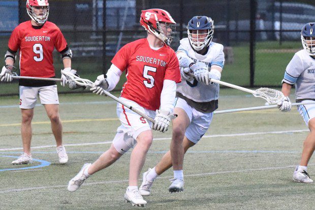 Souderton's John Martin Vince, 5, with the ball as North Penn's Sam Norton, 5, defends during their game on Thursday, April 18, 2024. (Mike Cabrey/MediaNews Group)