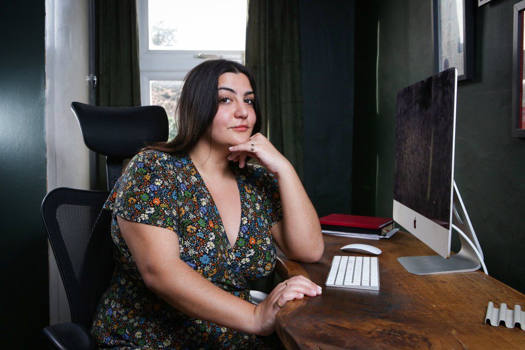 Almara Abgarian sitting at a desk with a computer