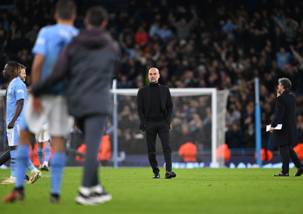 Manchester City boss Pep Guardiola looks on