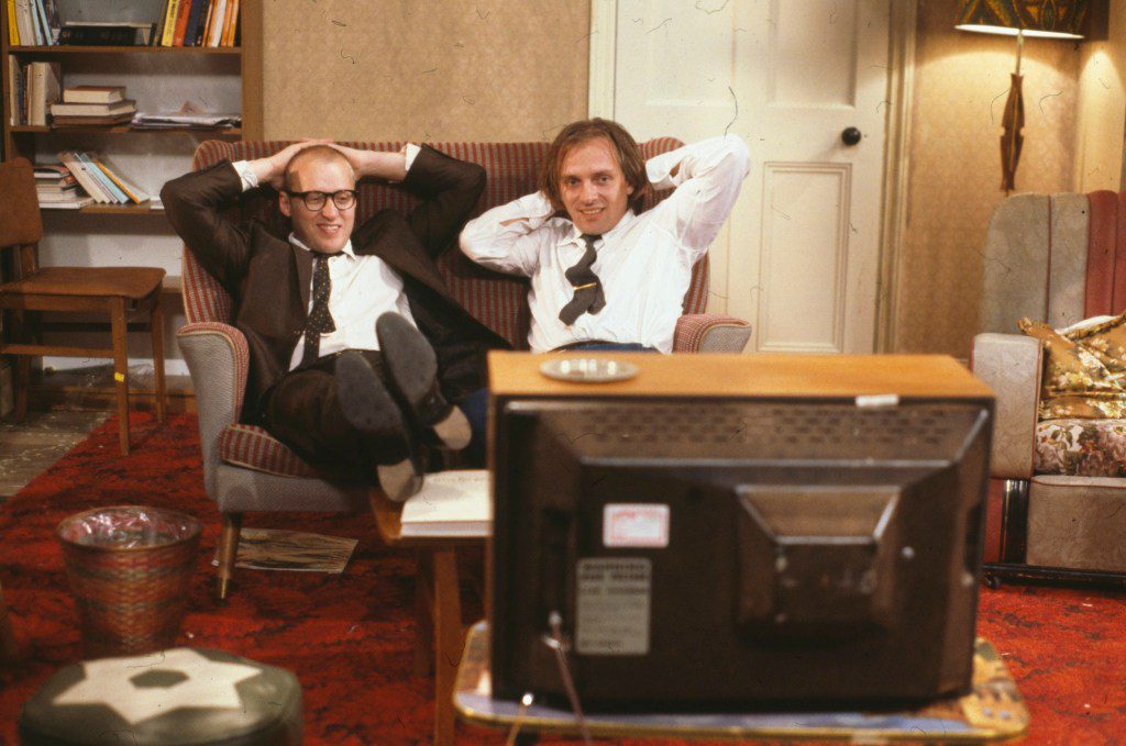 Adrian Edmondson (left) and Rik Mayall watching television in Bottom