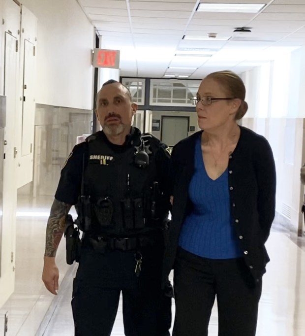 Jennifer Parker is escorted by deputy sheriffs from a Montgomery County courtroom on April 22, 2024, to begin serving prison term for leaving the scene after fatally striking a pedestrian. (Photo by Carl Hessler Jr. - MediaNews Group)