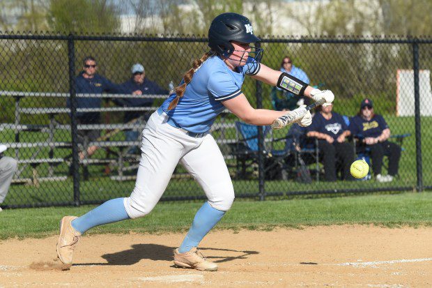 North Penn's Liv Stevens, 12 drops down a bunt in the bottom of the sixth inning against Council Rock South during their game on Tuesday, April 23, 2024. (Mike Cabrey/MediaNews Group)