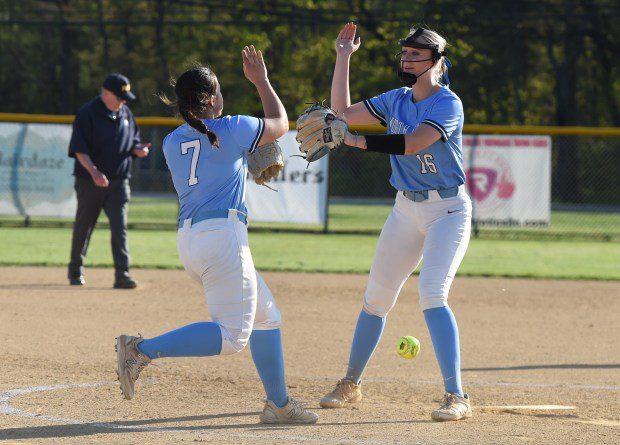North Penn's Gianna Cimino, 7, and pitcher Bella Nunn, 16, share a high five after the final out of the Knights' 1-0 victory over Council Rock South on Tuesday, April 23, 2024. (Mike Cabrey/MediaNews Group)