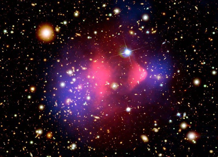 This composite image shows the galaxy cluster 1E 0657-56, also known as the "bullet cluster." This cluster was formed after the collision of two large clusters of galaxies, the most energetic event known in the universe since the Big Bang. 