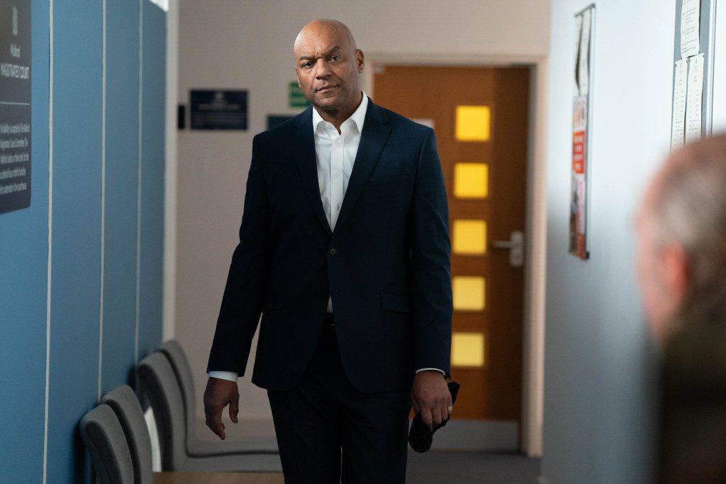George in the corridor in court in EastEnders