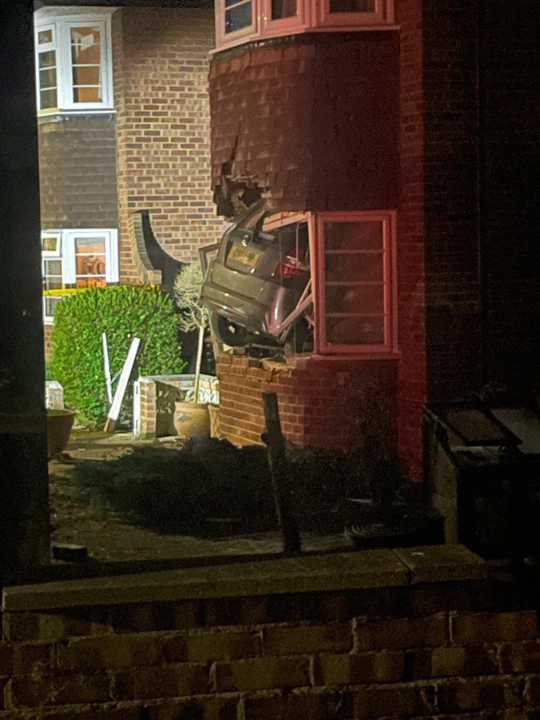 A house damaged after a car crashed into it in London.  
