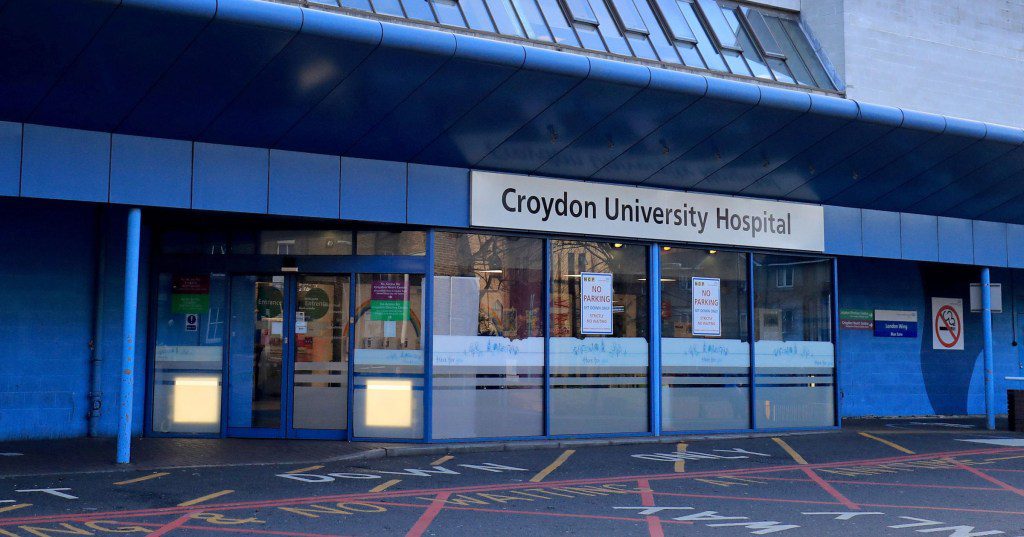 The front sign of Croydon University Hospital in south London, where a woman is being treated after ingesting poison. 