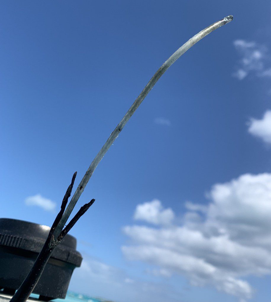 What is left of the electrical wiring on the mast after it was struck by lightning