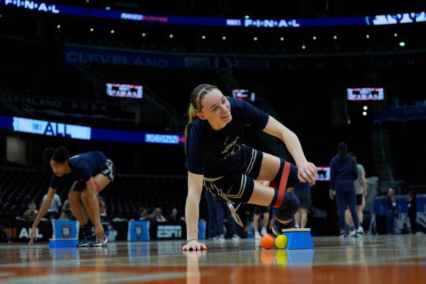 UConn's Paige Bueckers stretches during a practice for an NCAA Women's Final Four semifinals basketball game Thursday, April 4, 2024, in Cleveland. (AP Photo/Carolyn Kaster)