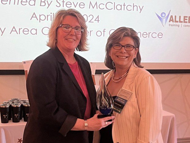 Eileen Dautrich, left, president of the TriCounty Area Chamber of Commerce was presented with an award recognizing her 25 years of service during the organization's annual dinner April 24.The award was presented by April Barkasi of Cedarville Engineering Group and chairwoman of the chamber (Photo Courtesy TriCounty Area Chamber)