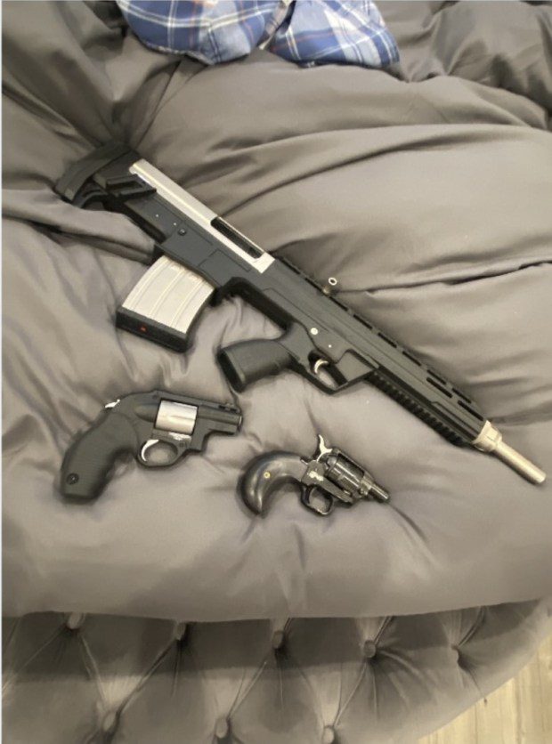Authorities display some of the weapons seized during investigation of multi-county gun trafficking network. (Photo courtesy Montgomery County District Attorney)