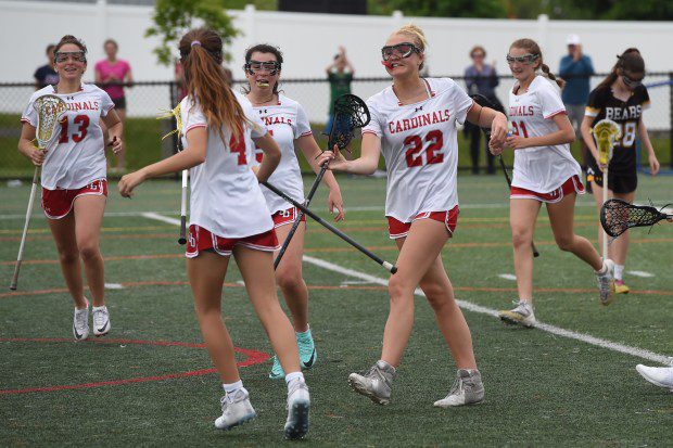 Upper Dublin's Paige Dinkel, 22, is congratulated by Shannon Connaughton, 4, after Dinkel's goal in the fourth quarter against Upper Moreland during their game on Monday, May 6, 2024. (Mike Cabrey/MediaNews Group)